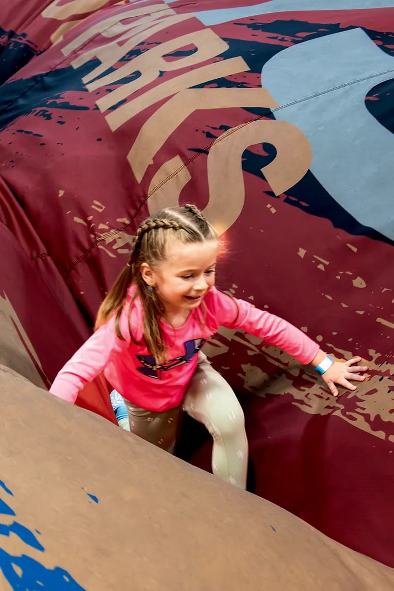 Child jumping onto the AeroSports air bag attraction