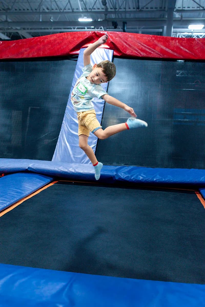 Kid jumping on trampolines during open jump at AeroSports